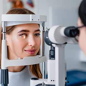 Healthcare provider examining patient's retina