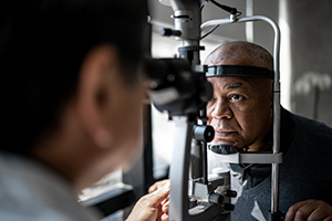 eye specialist examining patient's eye