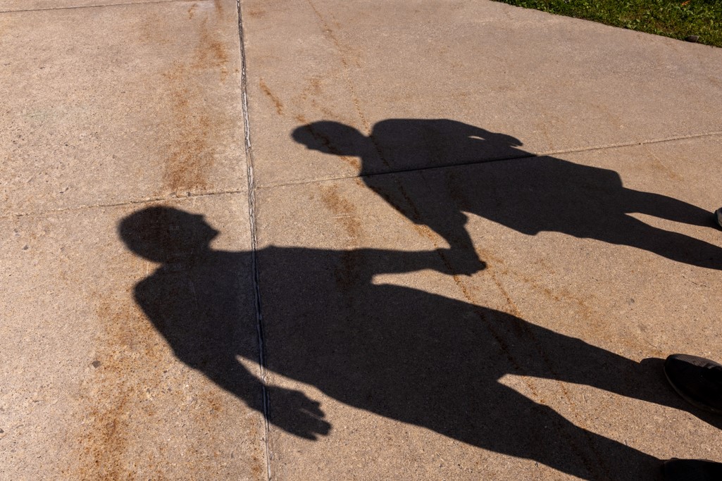 a photo of the tuckers' shadow on a sidwalk