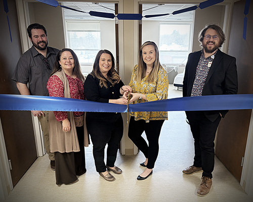 Munson Healthcare staff cutting a ribbon for the opening of the Cadillac Advanced Wound Center