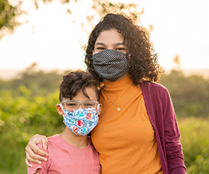 Mother and child wearing masks