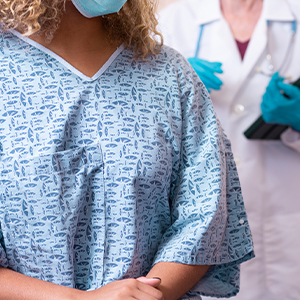 Woman in hospital gown
